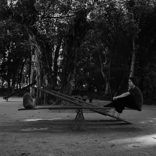 Seesaw, 2013. Video, 36’’ - The work shows two bodies of equivalent weight that seek balance between them. From this common place, the work seeks to talk about other characteristics of the stone that the body tries to incorporate, such as stability, permanence, limit and silence. Everything becomes so quietly still that it is only possible to perceive some movement by the shadow of the stone and the leaves of the trees in the background. The stability is subtle, delicate and precarious.