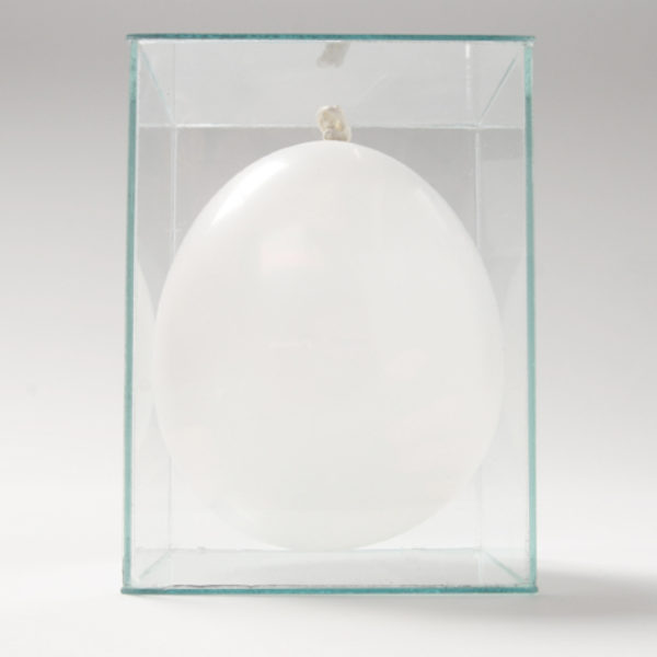 Breath, 2005. Balloon, one breath and glass box. - The work consists of a single breath, all the air that belongs to a person, showing at the same time his life force and his vulnerability. The glass box is made according to the measurements of the balloon, tangent to its limits. As time passes, the balloon deflates. The glass box remains as an attempt to hold on to that time, as a memory of its measure, and of its existence.